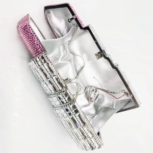 Detail of crystal lipstick clutch with silver and pink rhinestones and metal chain