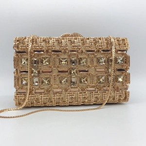 Luxurious gold evening clutch bag with sparkling rhinestones and crystal studs on chain