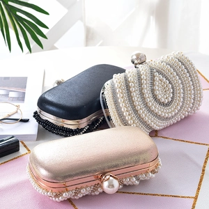 Elegante avondtassen met parels en strass in zwart, wit en champagne goud