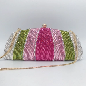 Detail of colorful vertical striped rhinestones on a luxury evening clutch with chain
