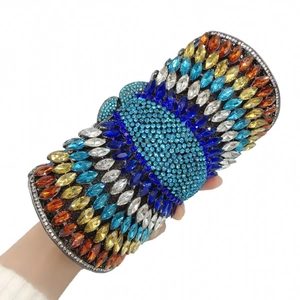 Macro shot of luxury evening clutch bag with hand-set colorful sparkling rhinestones