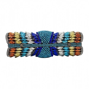 Macro shot of colorful rhinestone pattern and crystal inlay on the metal evening clutch bag