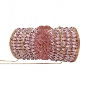 Detailed close-up of a pink crystal evening clutch with sparkling marquise rhinestones