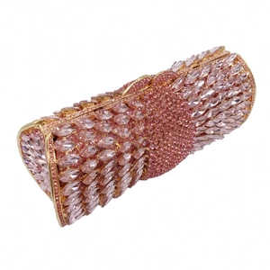 Detailed top view of pink crystal evening clutch with gold metal frame and marquise rhinestones