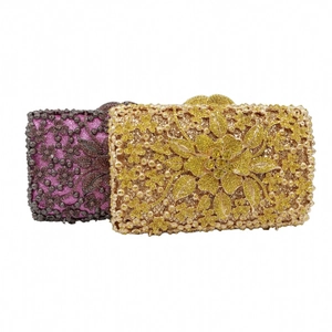 Close-up of luxury evening clutch bags with intricate floral rhinestone and bead patterns
