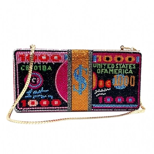 Macro shot of 1000 dollar bill pattern on a luxury rhinestone evening clutch bag