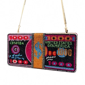 Close-up of dollar stack evening clutch bag with sparkling rhinestones and gold chain