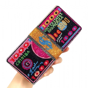 Sparkling crystal evening clutch bag featuring a unique stacked 10000 dollar bill design