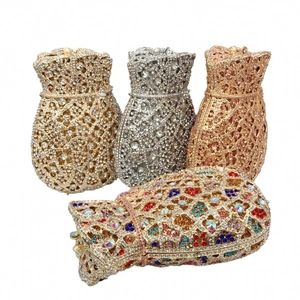 Detail of luxury rhinestone evening clutch bags in gold and silver showing crystal textures