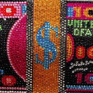 Luxury money stack clutch bag encrusted with sparkling crystals and dollar motifs