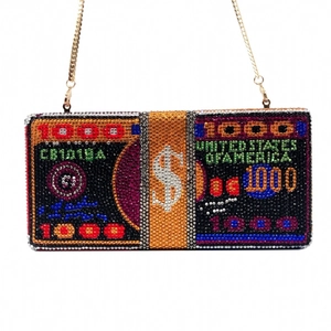 Macro shot of luxury crystal dollar clutch bag with colorful rhinestones and gold chain