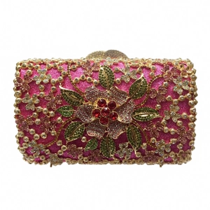Exquisite rose pink evening bag with gold floral hollow patterns and crystal embellishments