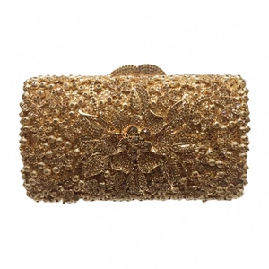 Detailed view of luxury gold evening clutch with floral crystal patterns and rhinestones