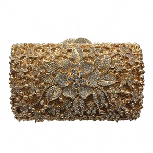 Macro detail of luxury dinner clutch featuring hollow metal and exquisite crystal floral pattern