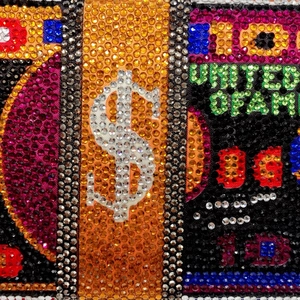 Macro shot of colorful rhinestone money stack clutch with crystal dollar bill details