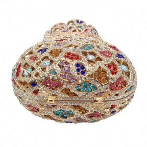 Detailed close-up of intricate hollow floral patterns and colorful crystal inlay