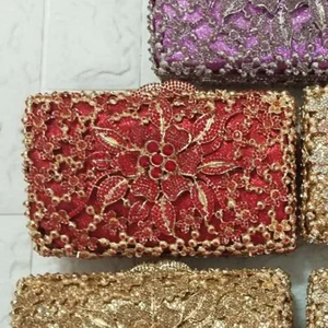 Detailed view of handmade floral evening bags with sparkling sequins and luxury crystals