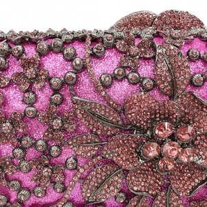 Macro detail of rose pink sequins and floral metal hollow-out with pink rhinestones