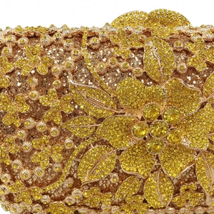 Golden evening clutch bag with intricate 3D floral rhinestone patterns and luxury crystal finish