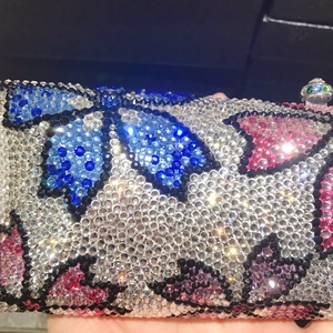 Luxury floral crystal clutch bag with colorful rhinestones and sparkling metal clasp