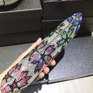 Luxurious lipstick-shaped evening clutch with colorful floral crystals and silver hardware