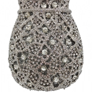 Macro view of silver evening clutch showing hollow texture and luxury crystal clusters