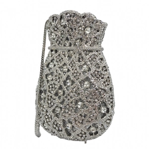 Macro shot of silver evening clutch bag with sparkling rhinestone mesh and chain strap