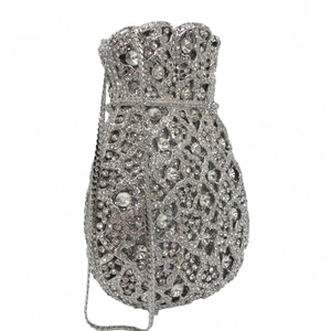 Detailed macro view of silver rhinestone bucket evening bag with crystal hollow patterns