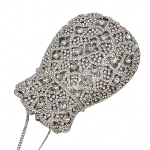 Detailed macro view of high-quality sparkling rhinestones on the silver evening clutch bag