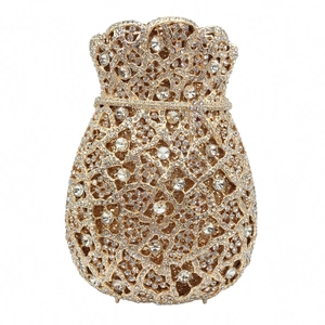 Macro shot of gold money bag evening clutch with luxury rhinestones and crystal details