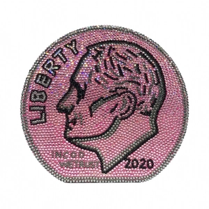 Sparkling pink rhinestone round clutch bag featuring a detailed liberty coin design