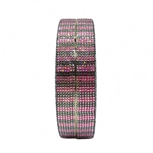 Side view detail of rhinestone evening bag with pink black and silver crystal stripes