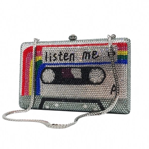 Macro view of crystal encrusted cassette evening bag with colorful rainbow stripes