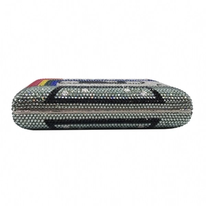 Macro view of crystal encrusted cassette evening clutch with colorful rainbow pattern