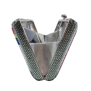 Detailed view of luxury evening clutch with silver crystals and colorful rhinestone accents