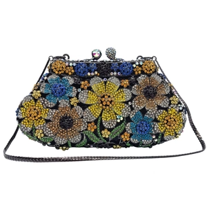 Detail of colorful daisy crystal evening bag with intricate rhinestone floral patterns