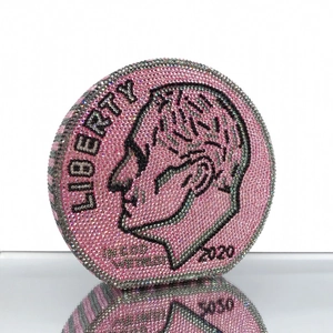 Close-up of pink and silver crystal coin dinner clutch with Liberty dime pattern