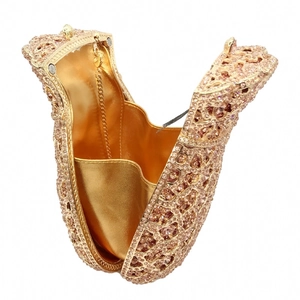 Top view of pink gold leopard print rhinestone evening bag with chain and gold lining