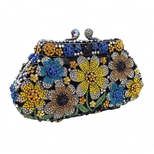 Detail of colorful daisy rhinestone flower pattern on the luxury evening clutch bag