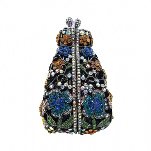 Close-up of colorful rhinestone daisy patterns on a vintage-style evening clutch bag