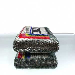 Detailed macro view of vintage cassette tape clutch bag with multicolor crystal rhinestones