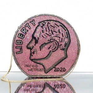 Close-up of Liberty coin round evening bag with pink rhinestones and gold chain strap