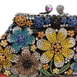 Macro detail of colorful daisy rhinestones on luxury evening clutch with crystal inlay
