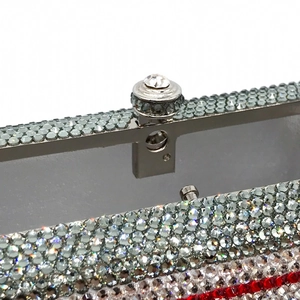 Close-up of the silver metal clasp and luxury crystal rhinestone cassette evening bag