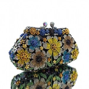 Detailed close-up of a luxury evening clutch featuring colorful floral rhinestone patterns