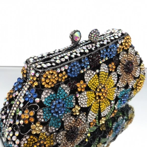 Detail of colorful daisy crystal floral patterns on a luxury evening clutch bag