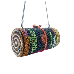 Detail of crystal dollar roll clutch with colorful rhinestones and metal chain strap