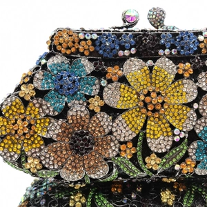 Macro shot of colorful rhinestone flower patterns on a luxury crystal clutch evening bag