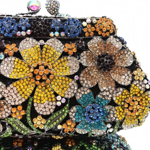 Macro detail of luxury floral evening bag showing intricate multi-color crystal inlay