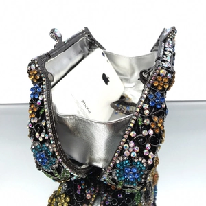 Black evening clutch bag with colorful rhinestone flower patterns and silver silk lining